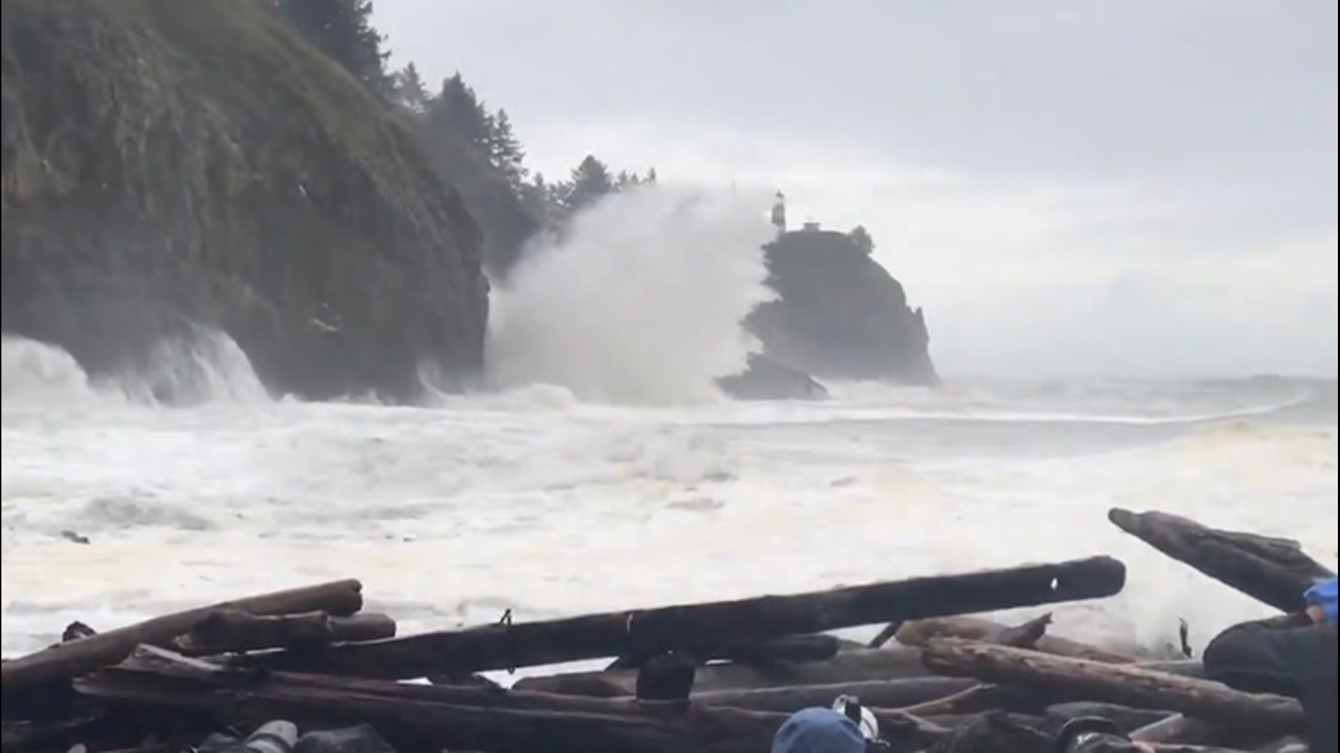 Crowds gathered to watch and photograph large waves during king tides at Cape Disappointment, Washington, on Nov. 15.