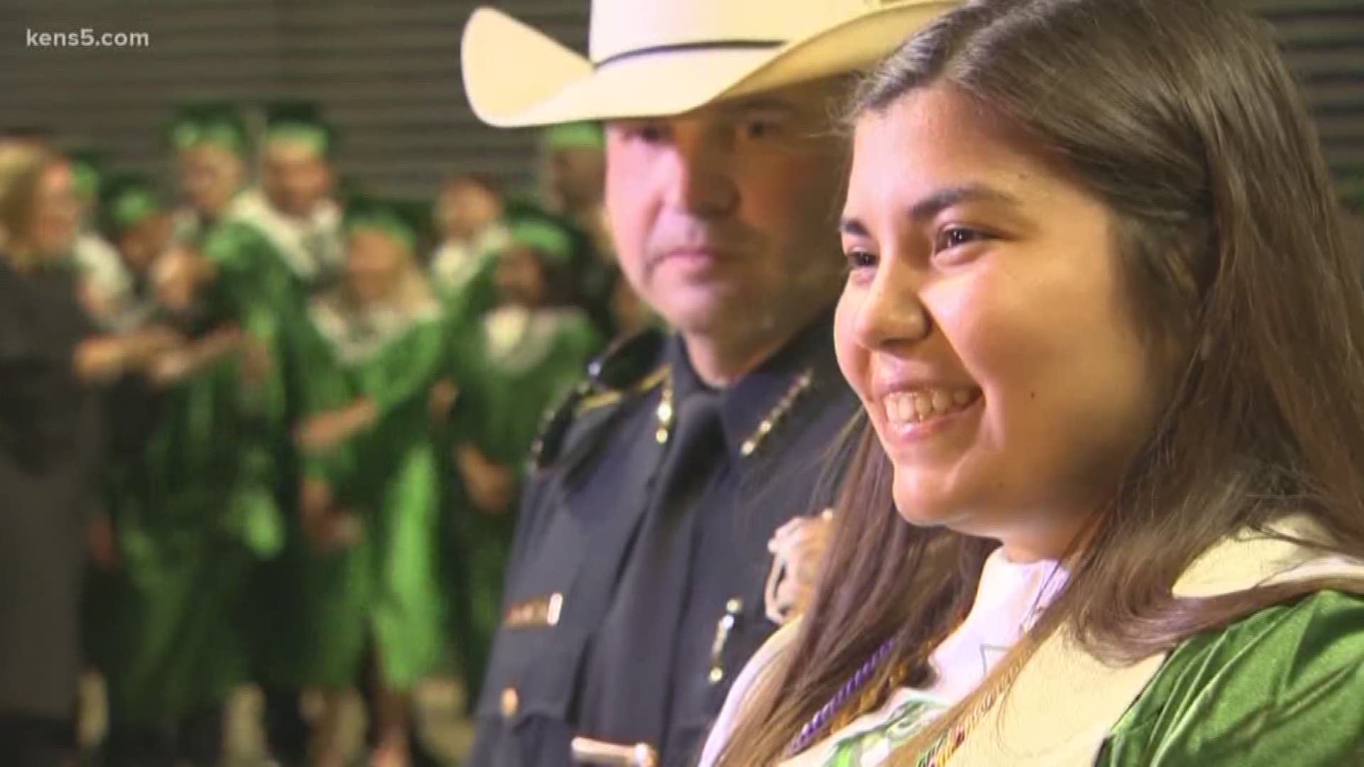 Peace officers escort Southwest High School graduate whose father was  killed in the line of duty