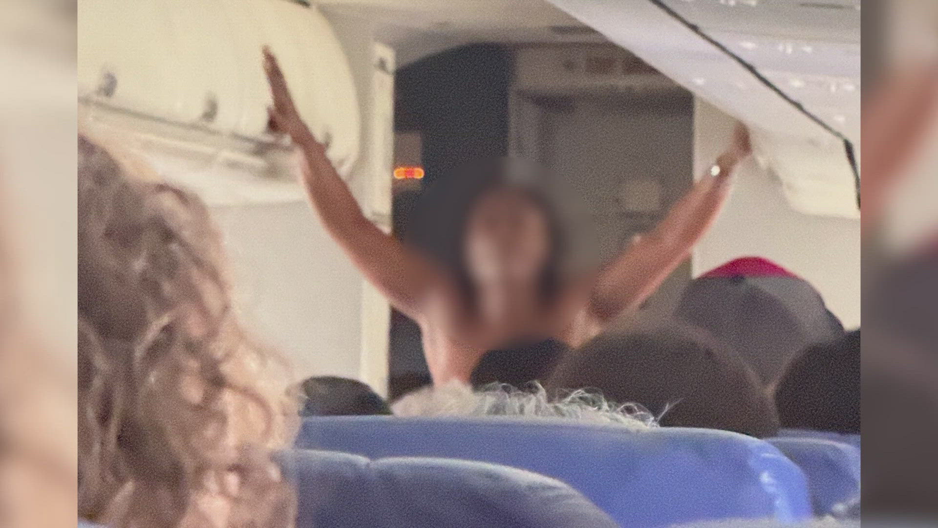 At one point, passengers say the naked woman banged on the cockpit door and asked to be let in.