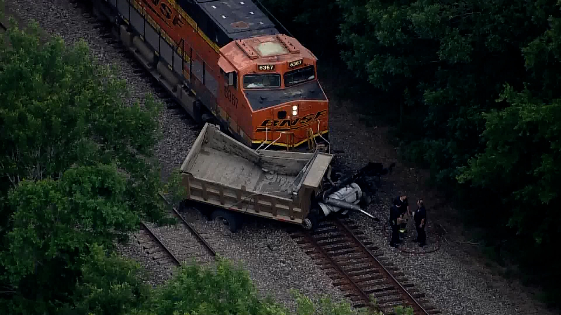Officials said one person is dead after a train slammed into a dump truck in the Richmond area Wednesday morning.