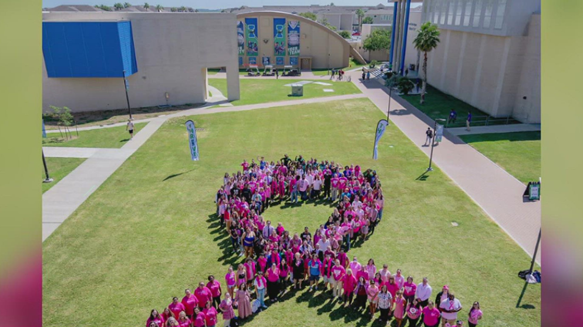 Nearly 200 TAMU-CC faculty, staff, and students gathered in a sea of pink and formed a giant cancer ribbon logo.