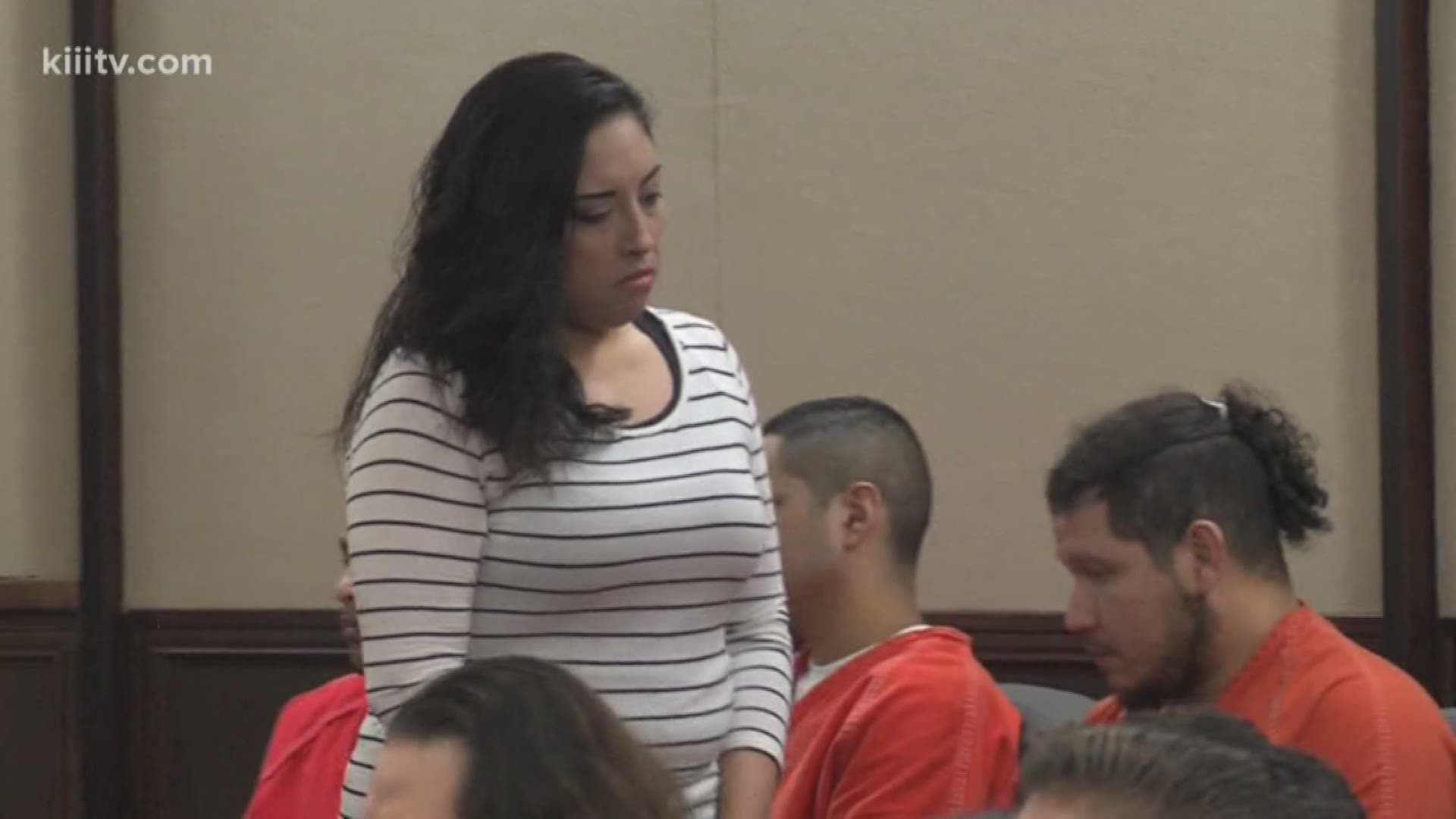 A woman accused of taking part in a gruesome murder is now back in jail for breaking her bond conditions.