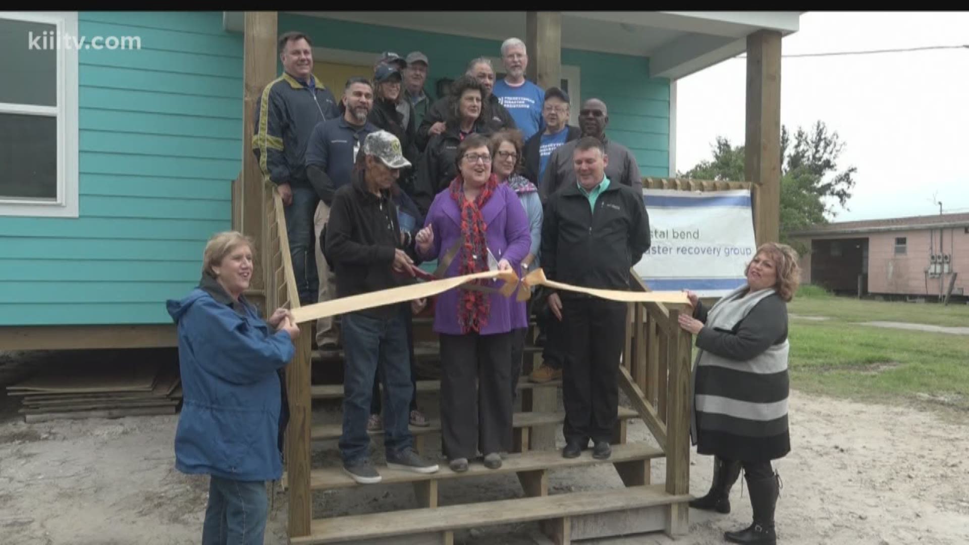 A Fulton couple whose house and popular seafood restaurant were destroyed during Hurricane Harvey received the keys to their brand new home Wednesday morning.