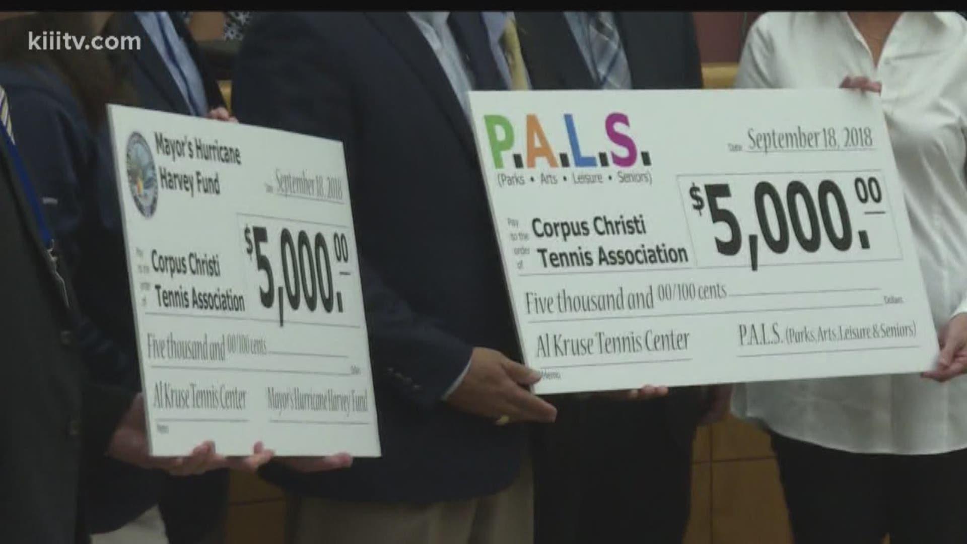 Two $5,000 checks were presented during Tuesday's Corpus Christi City Council meeting to the Al Kruse Tennis Center.