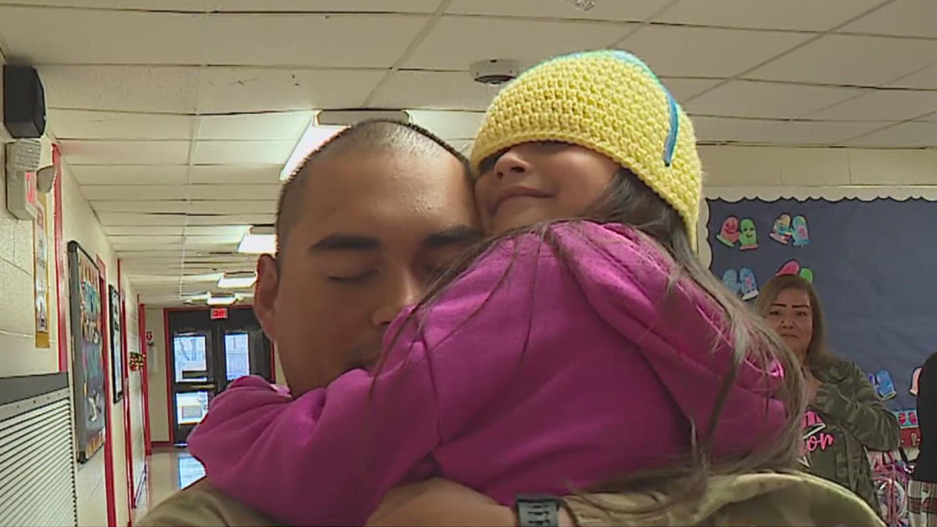 Kailia Cruz saw her dad, Adrian, and jumped into his arms.