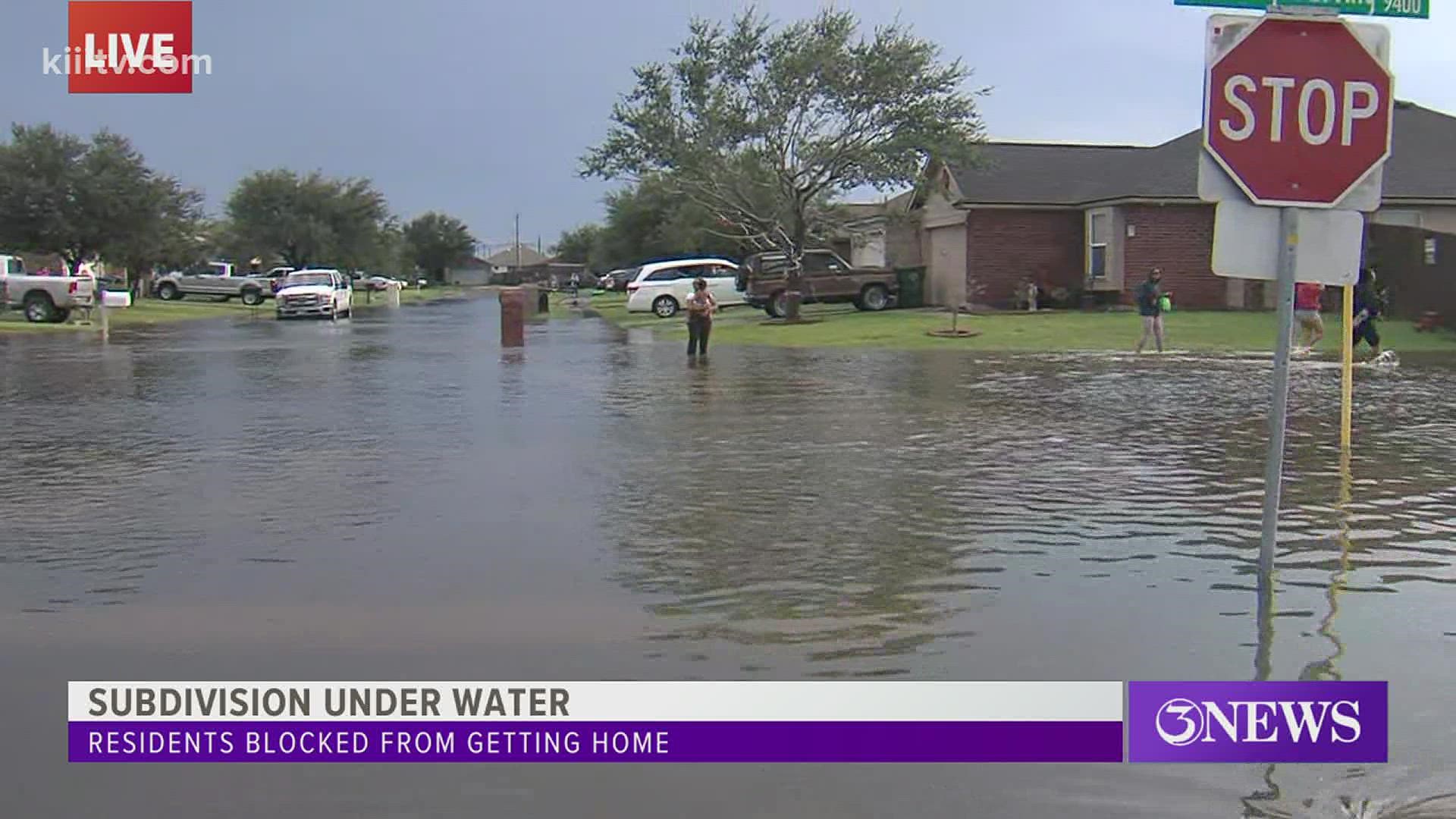 Residents trying to get to their homes in the neighborhood were told they will have to wait for the waters to recede.