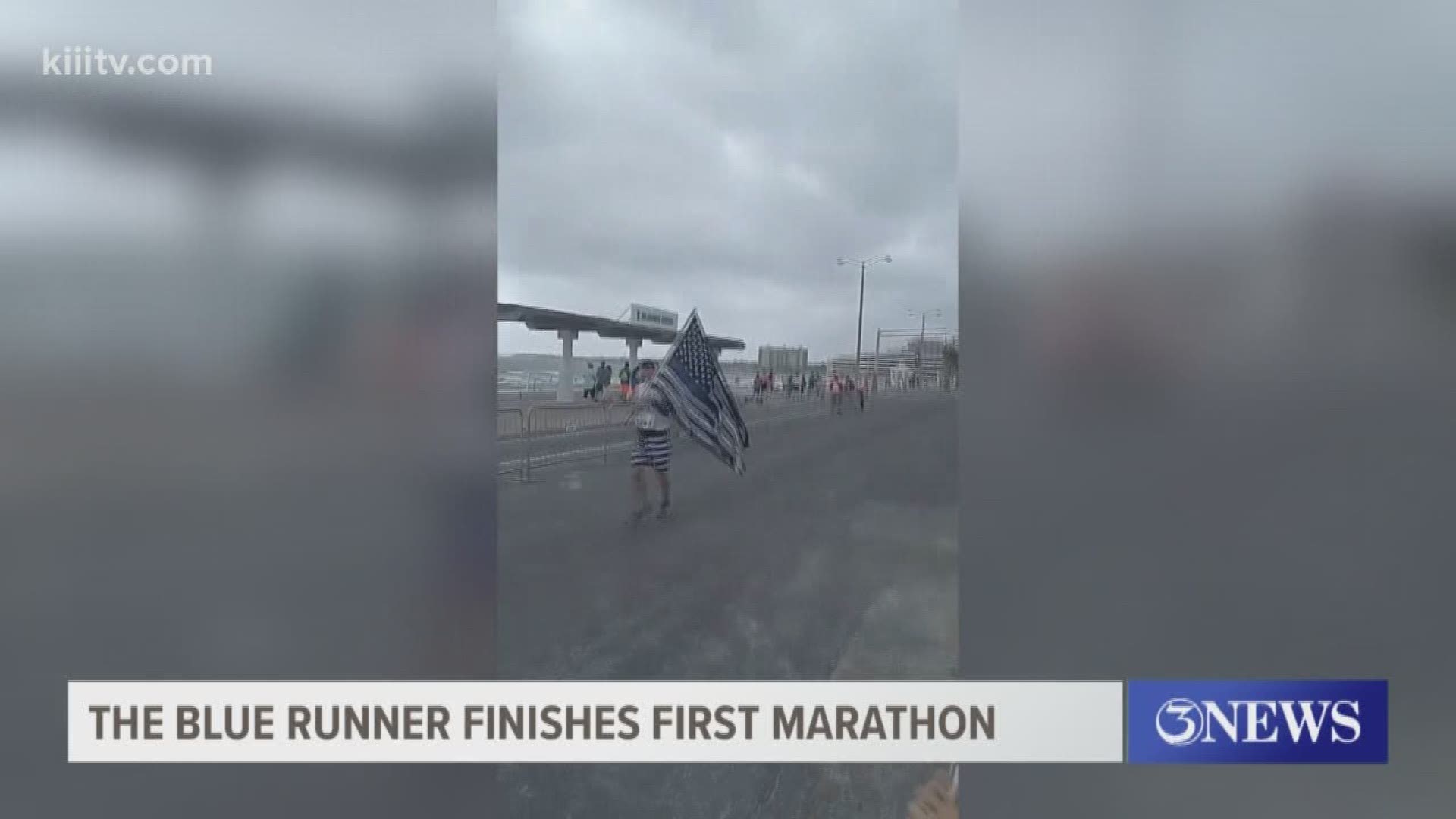 Joshua Taylor ran all 26.2 miles with his flag in hand.