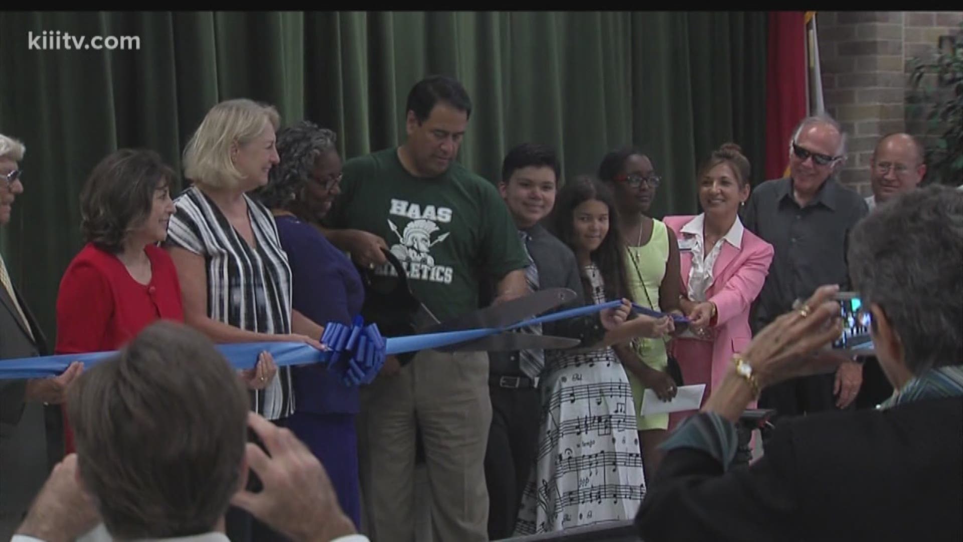 A long-awaited first step towards consolidating Cullen Middle School students into Haas Middle School was completed Friday with a ribbon cutting on McArdle Road. 
