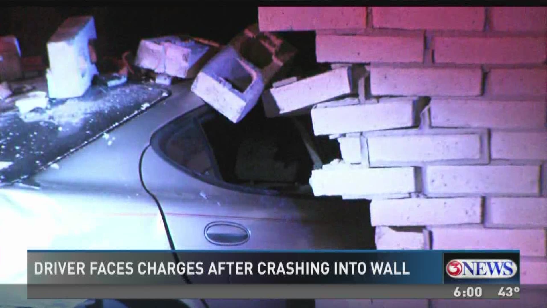 A driver is facing charges after crashing his vehicle into a brick wall. 