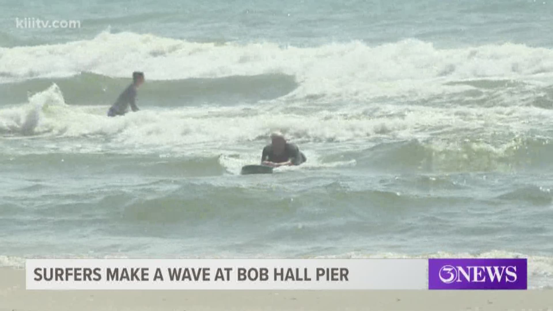 The waves near Bob Hall Pier were speckled with surfers on Sunday morning.