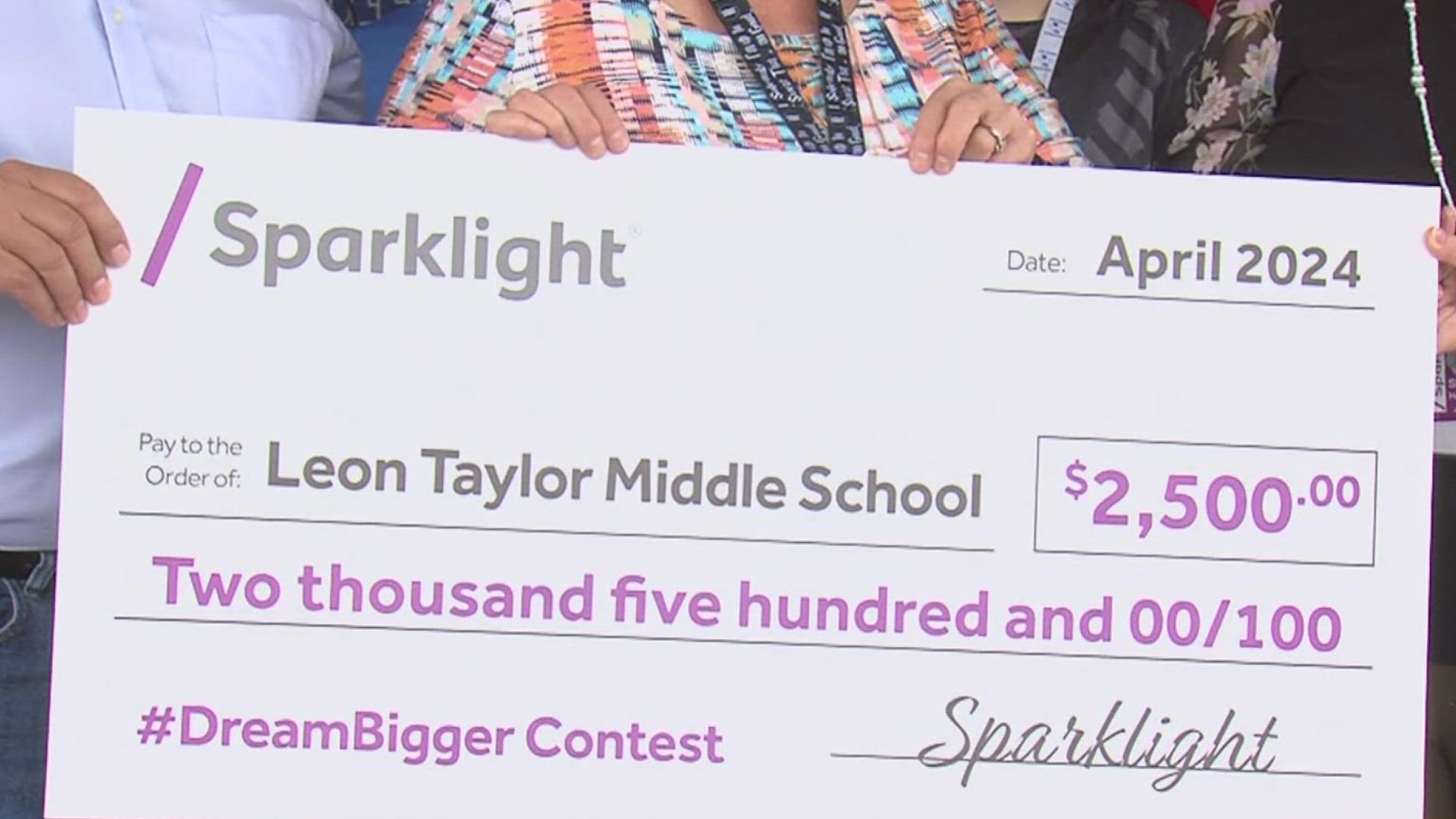 Suzanne Kilburn was awarded a check for $2,500 Sparklight's Dream Bigger contest for her success in STEM education.