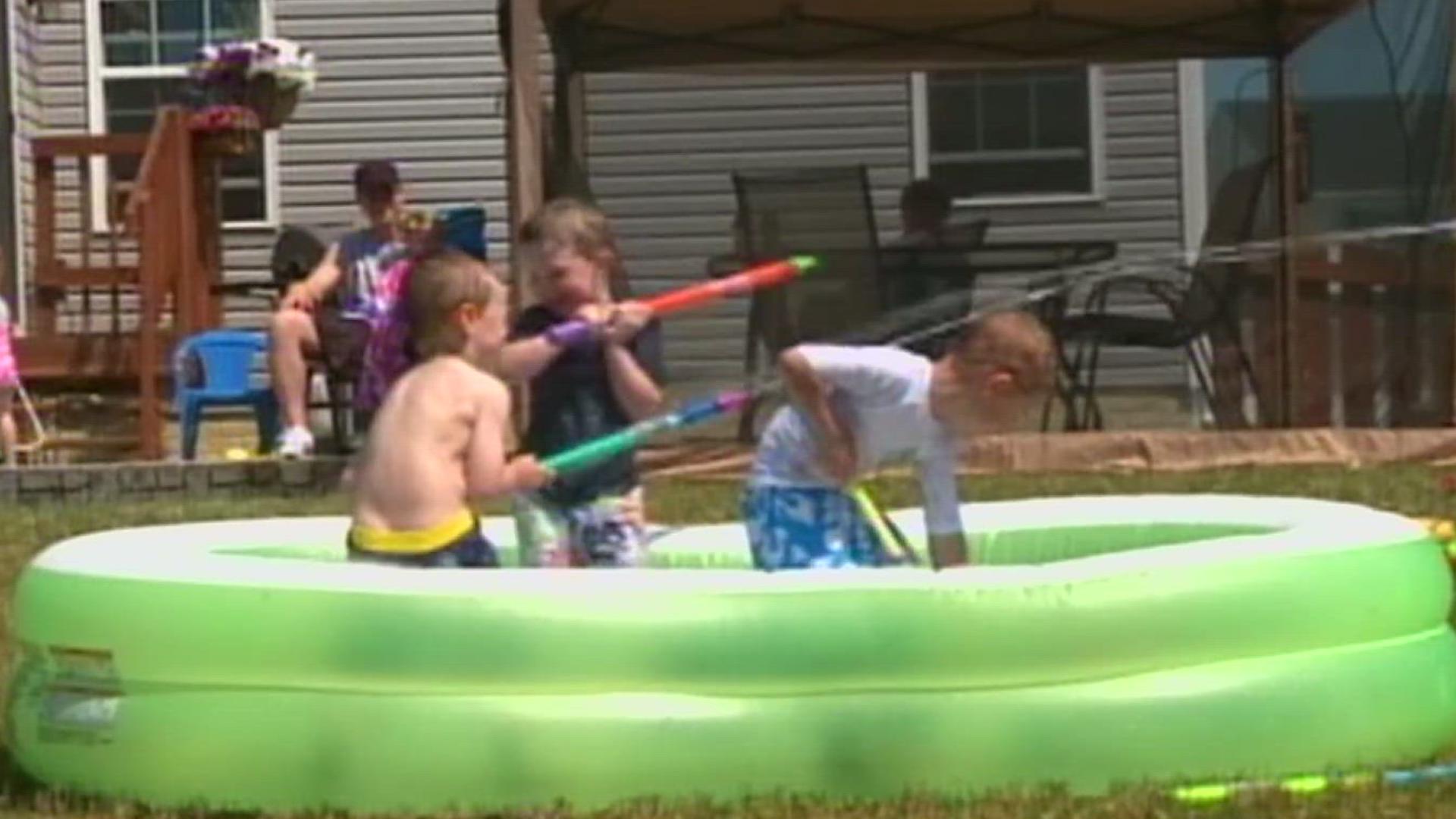 kids having a water gun fight