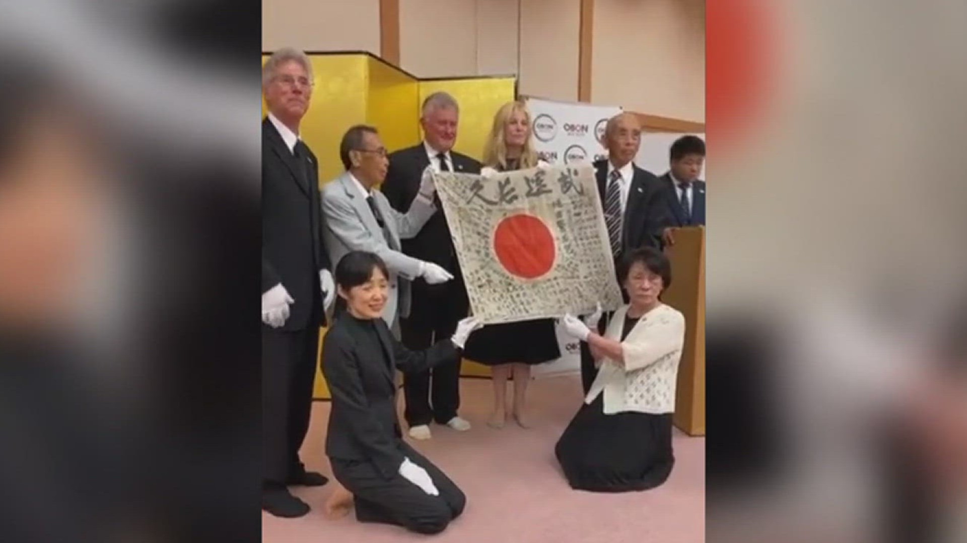 The flag was viewed as Mutsuda's spirit returning home, reuniting with his wife who recently passed away at the age of 102.