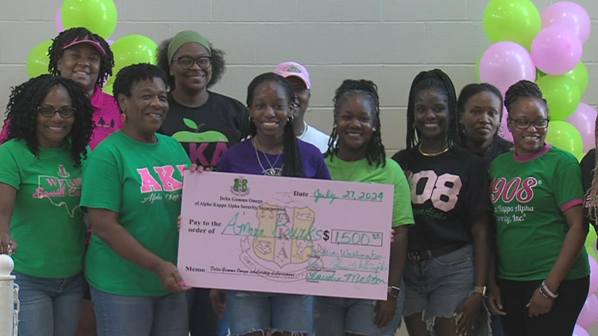 The Alpha Kappa Alpha Sorority awarded three African American females with scholarships.