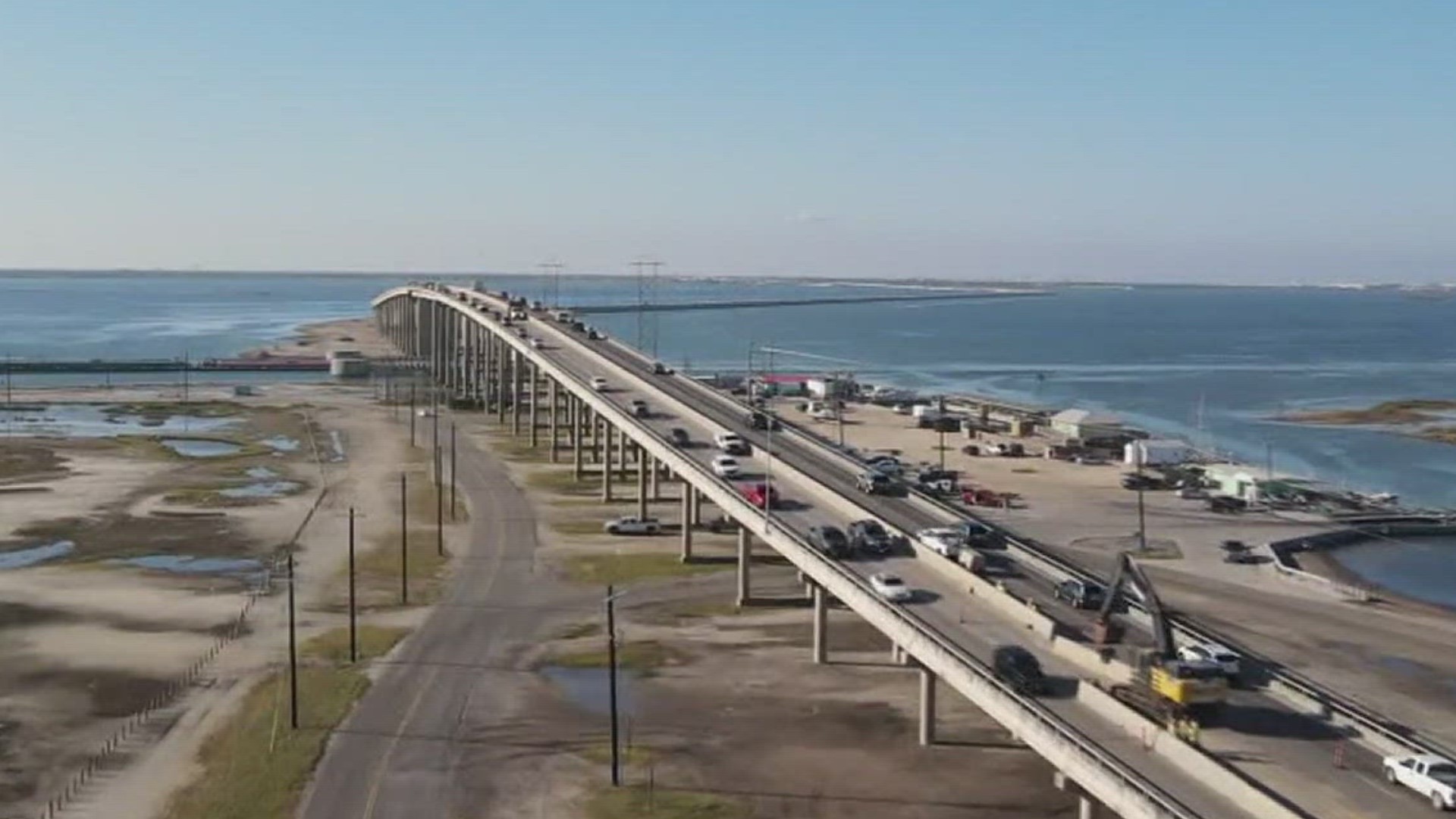 Workers will install a concrete barrier as part of the ongoing project to maximize the life of the bridge.