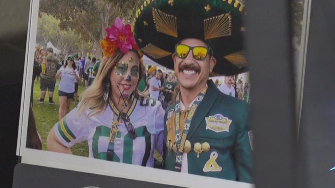 A fan puts his sombrero on Green Bay Packers running back Aaron