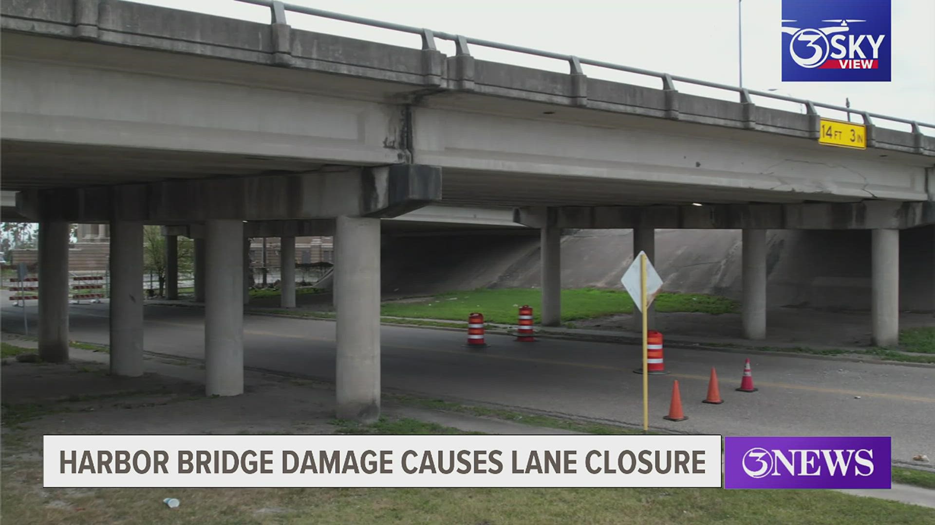 Photos show a large crack running through the bridge over Belden St. near Tancahua.