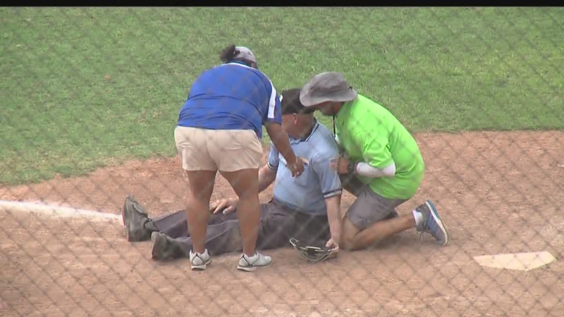 Umpire passes out from heat