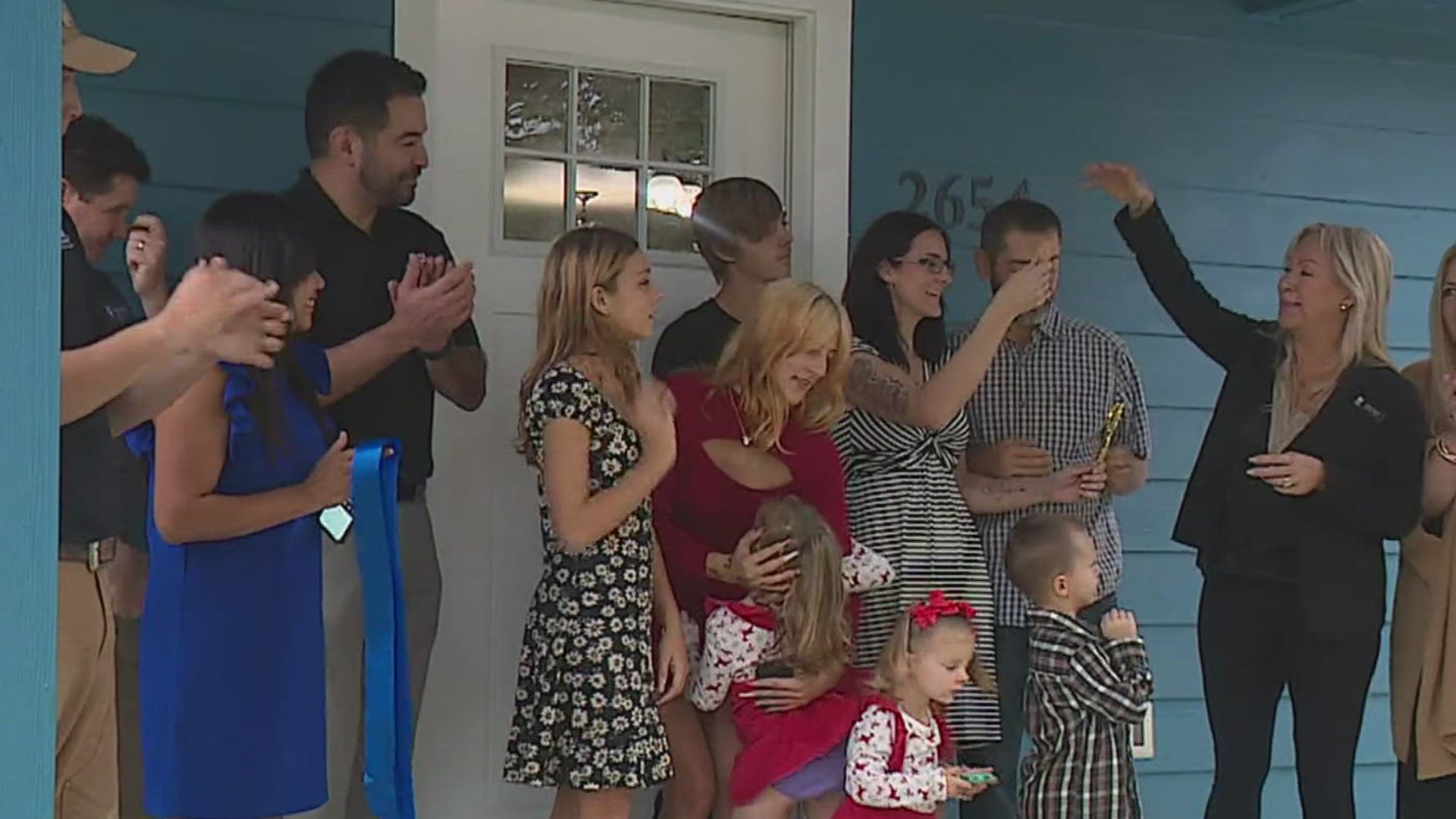 The Thomas family received the keys to their new abode Friday morning.