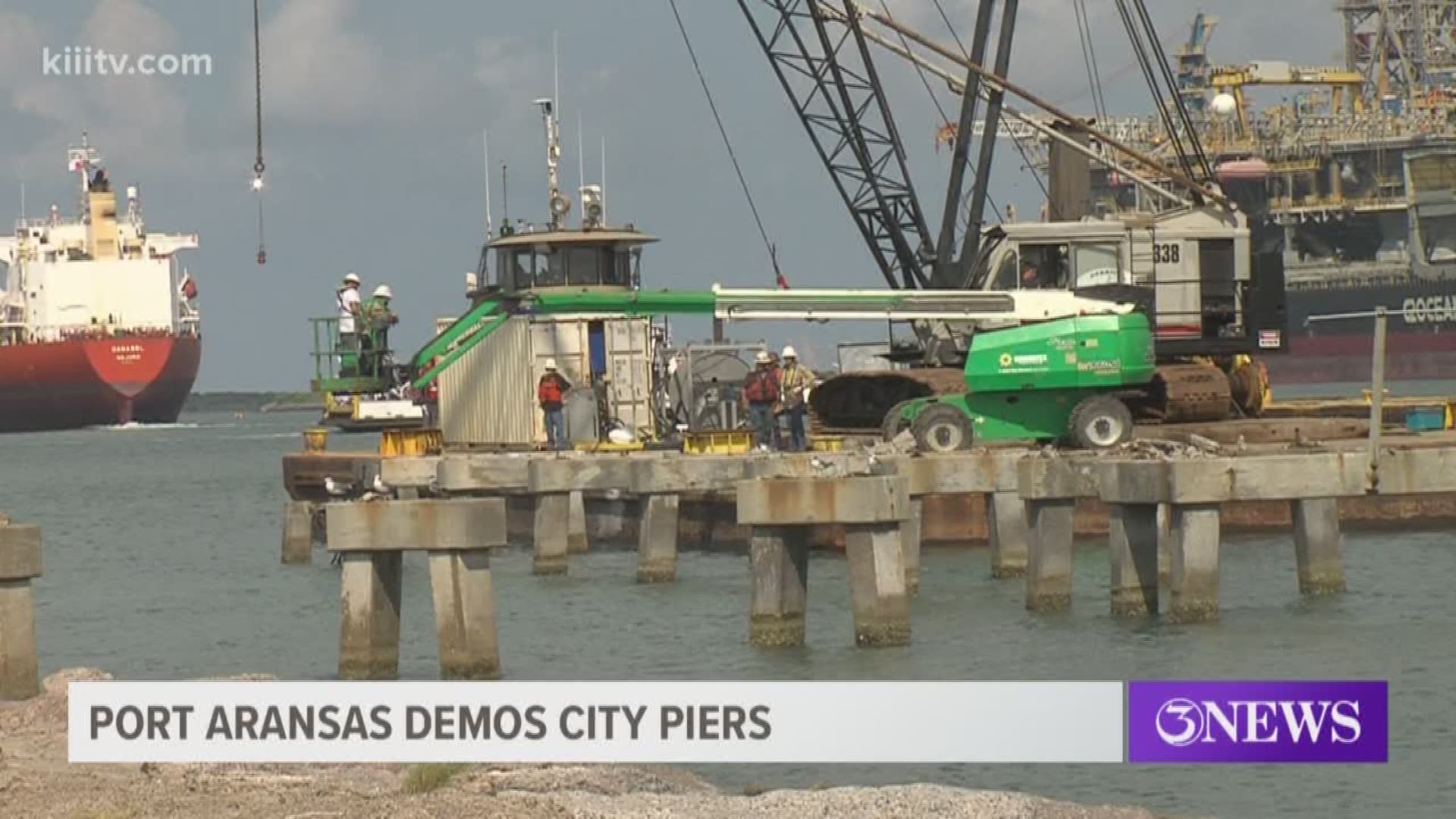 Demolition began Tuesday on one of three city piers in Port Aransas, Texas, that were destroyed by Hurricane Harvey. A crane was moved into place to start taking the piers apart.