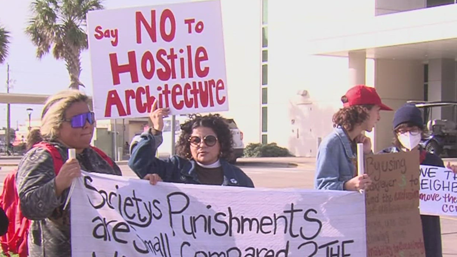 The protesters said the bar feature on the bus benches violates homeless individuals' civil rights.