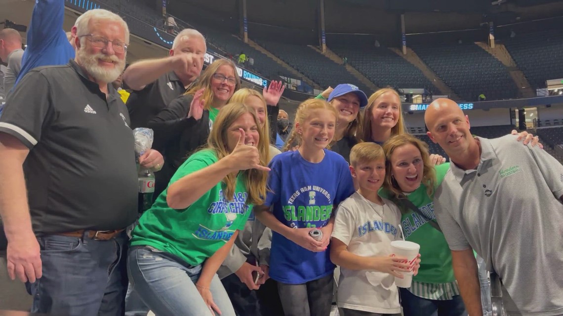 Islanders coach Steve Lutz goes into the stands to be with family after