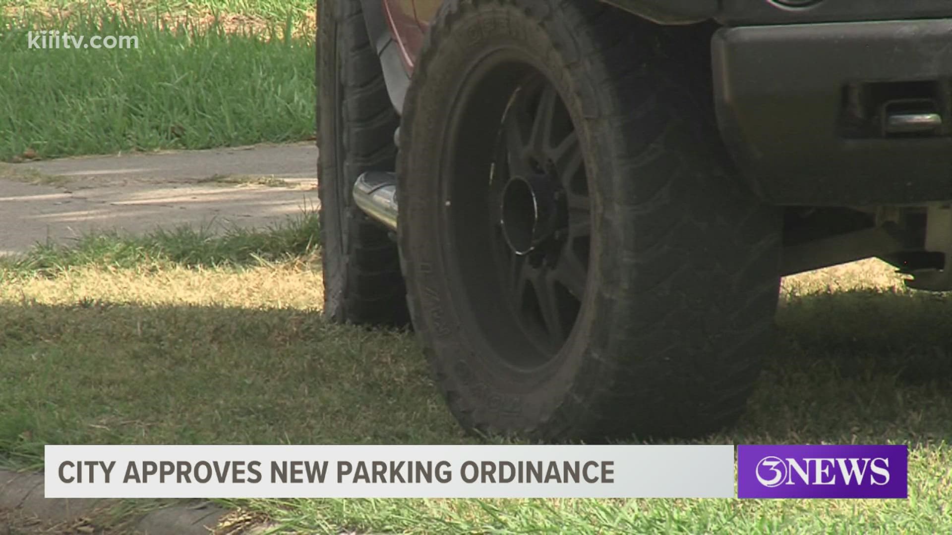 City leaders have banned parking on any surface that is not made of asphalt, concrete or brick.