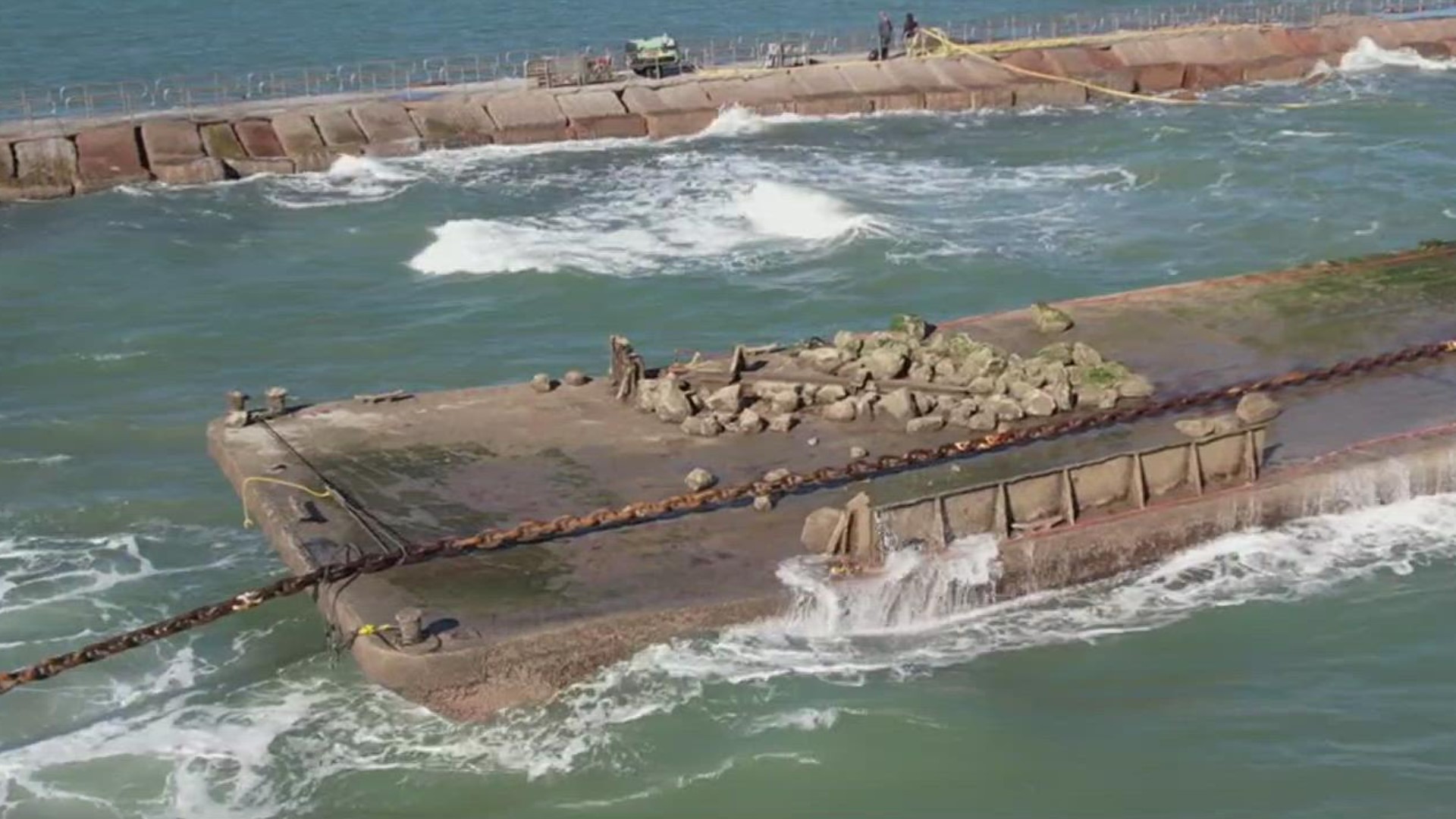 Work had been delayed because of high winds this week, but it looks like the barge will finally come out of the water Friday night.