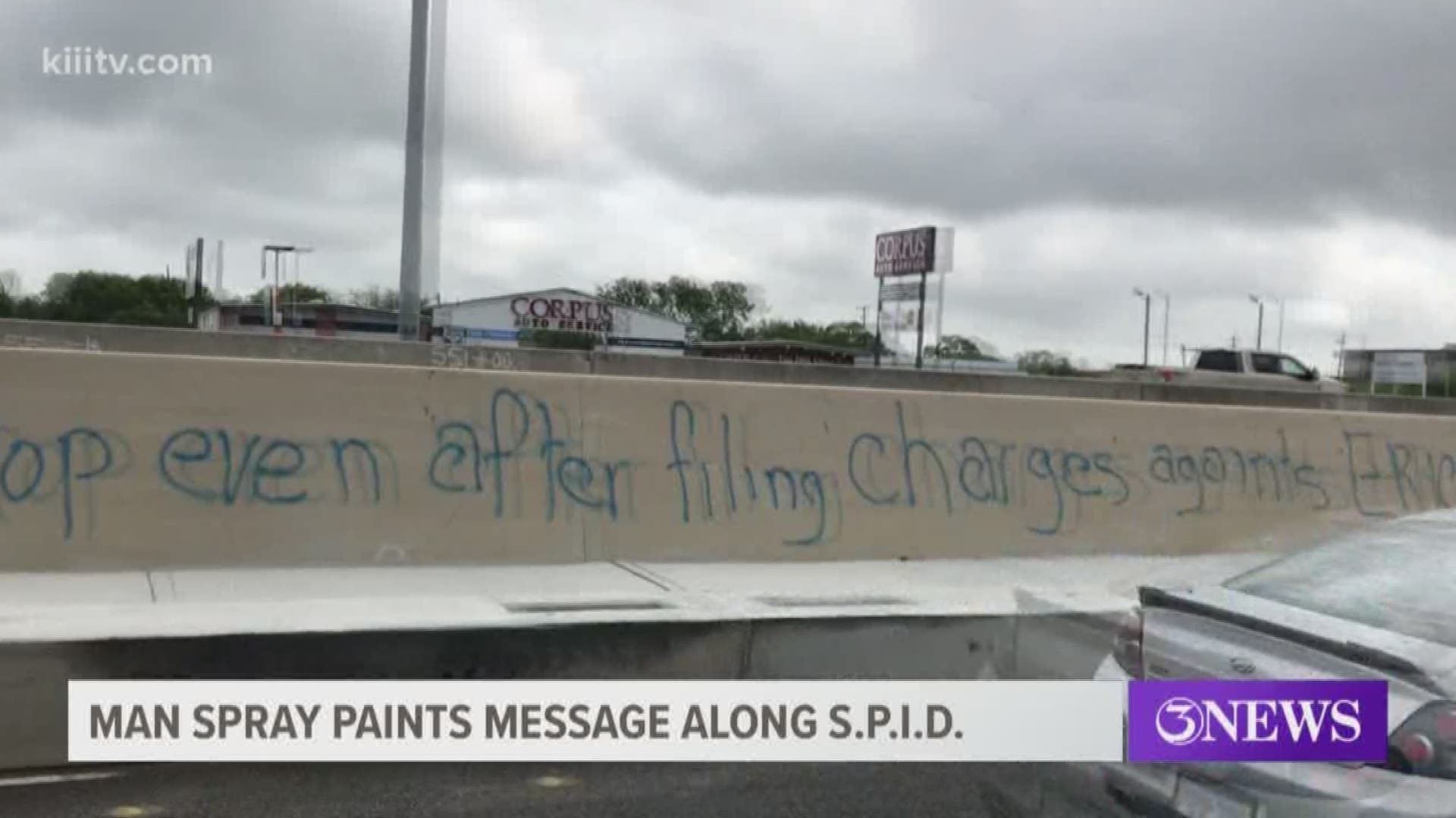 Police arrested a man Tuesday morning after he spray painted a message on a concrete barrier along eastbound SPID near the Corpus Christi Trade Center.