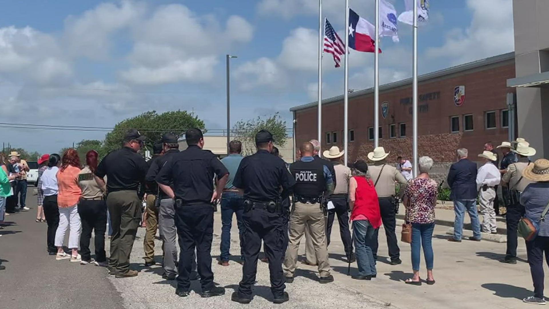 The community gathered outside the police station Wednesday morning to join city leaders in remembering the commitment to serve as was exemplified by the officers.