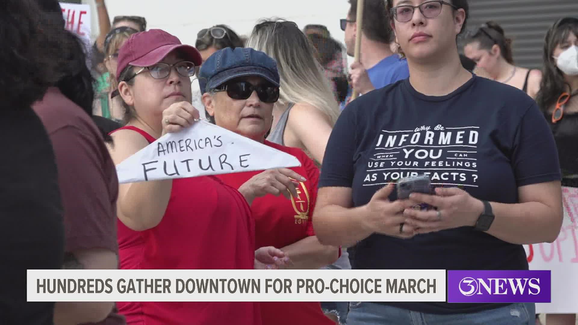 The march began on North Carancahua Street and ended outside the Corpus Christi Federal Courthouse.