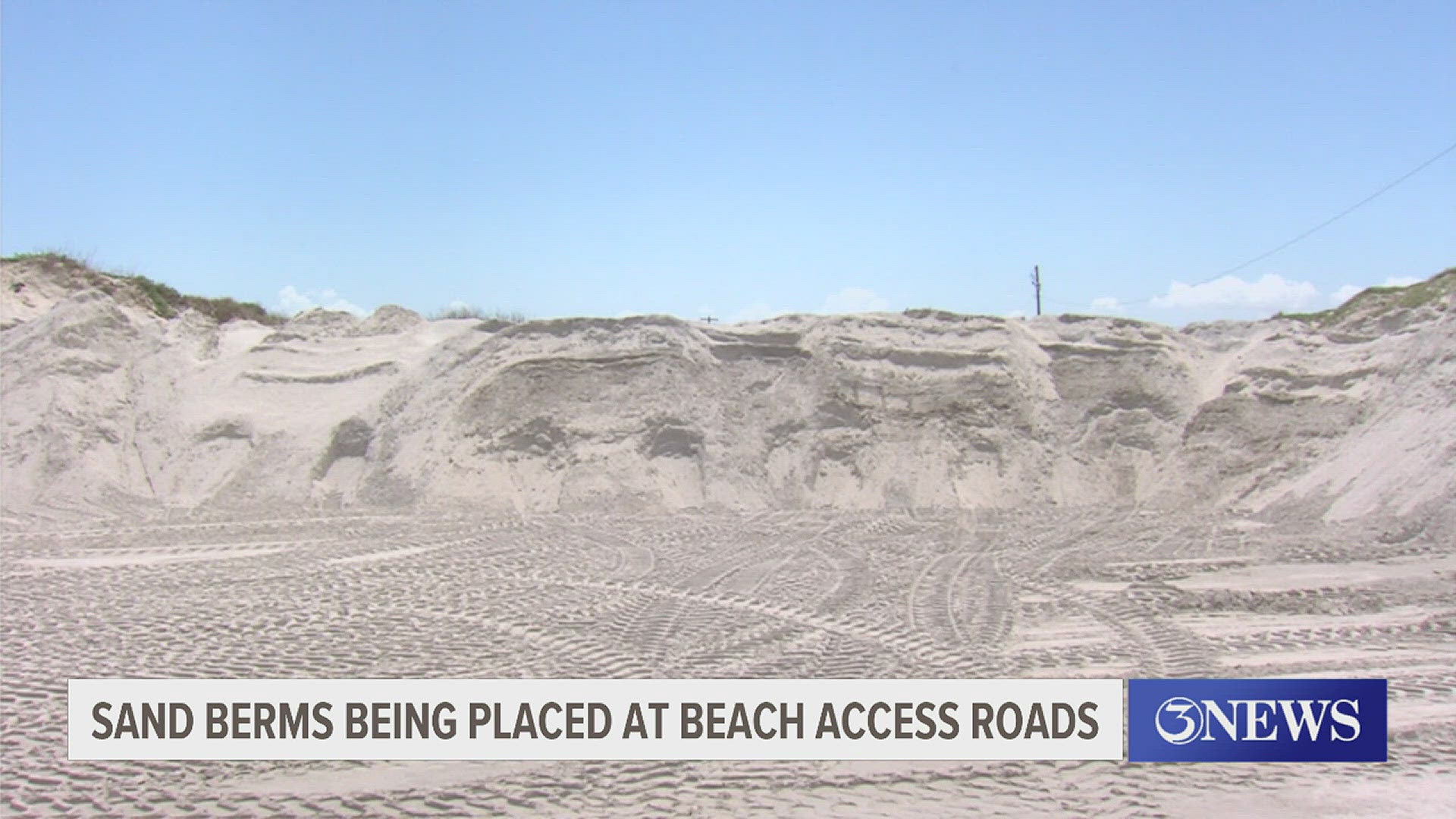 Sand berms are being placed at beach access roads.
