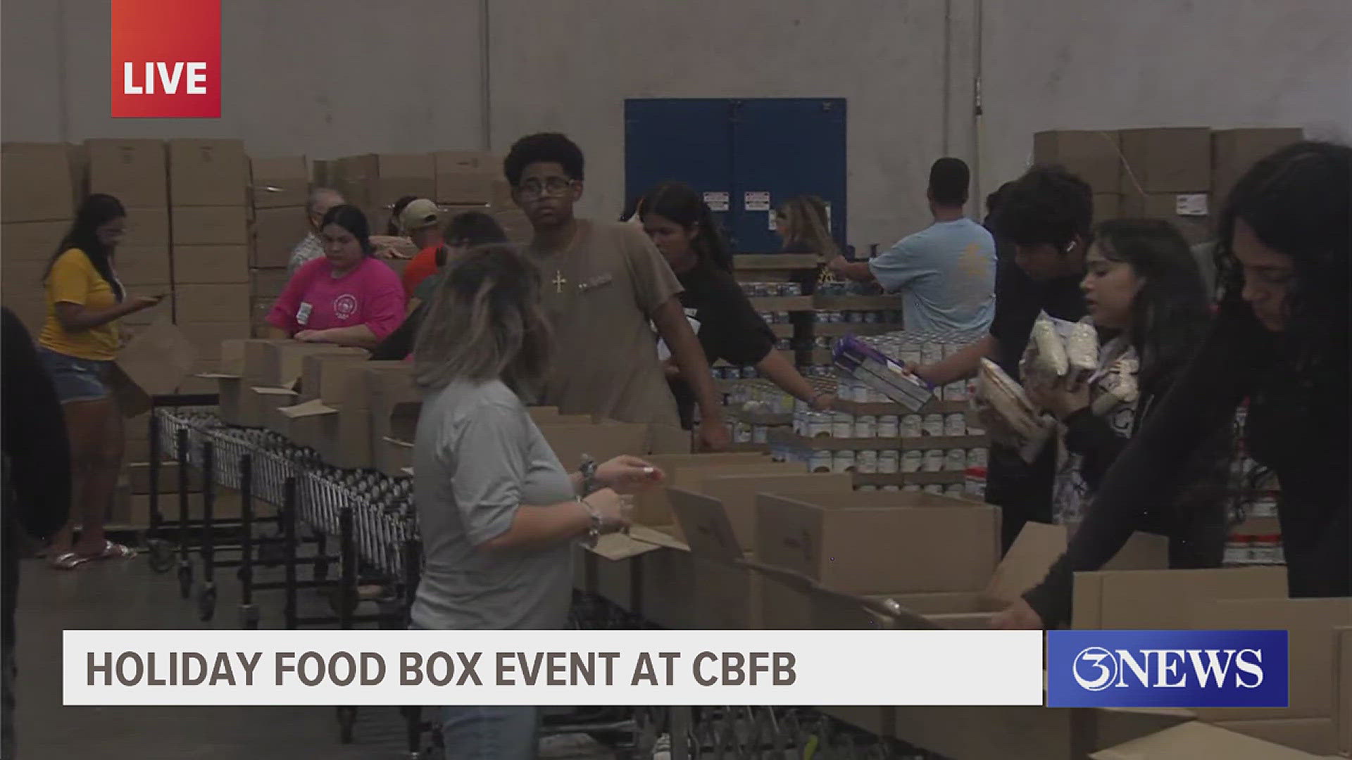 Look at all those helping hands! They are building 1,000 food boxes to be distributed to those who need it this coming holiday season.