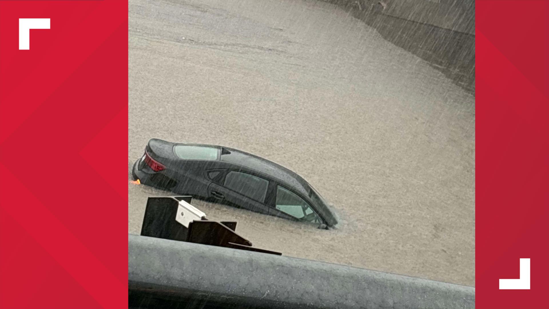 Several motorists sent us pictures and video showing the progress of a small vehicle succumbing to flash flood waters on NPID and Leopard Street on Thursday morning.