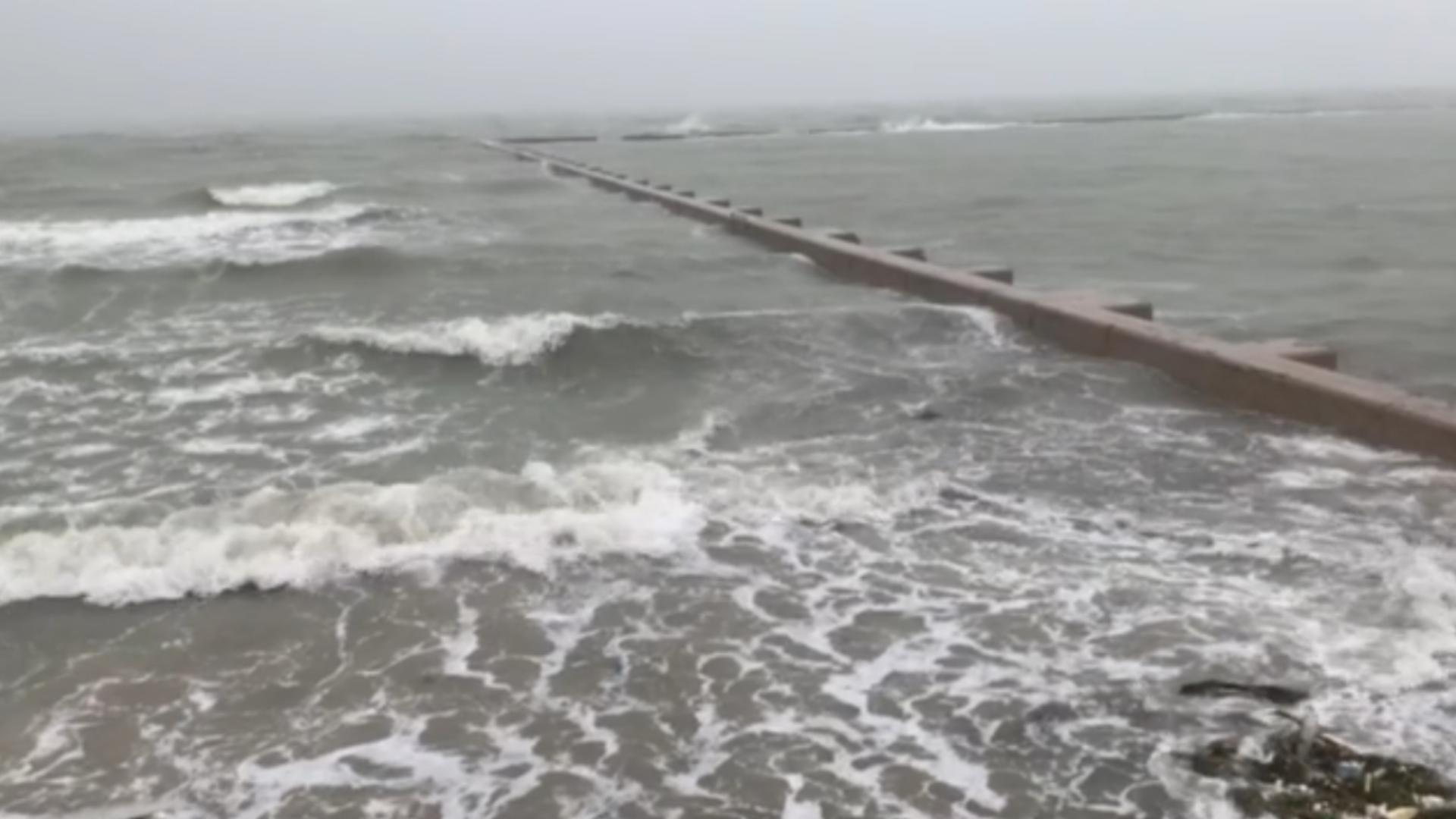 9:35 AM Wednesday- Waves crashing at holiday inn express on shoreline.