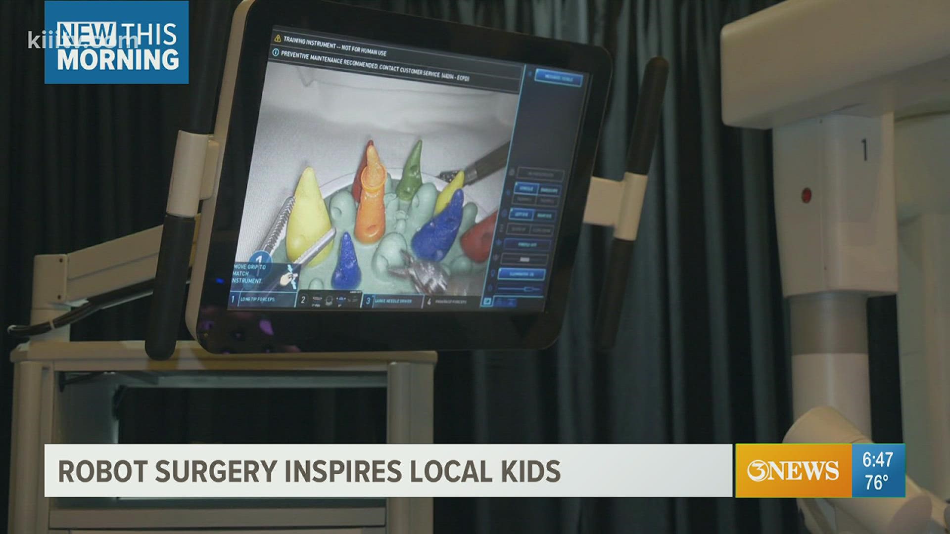 Kids interacted with a robot system that helps perform minor invasive surgeries.