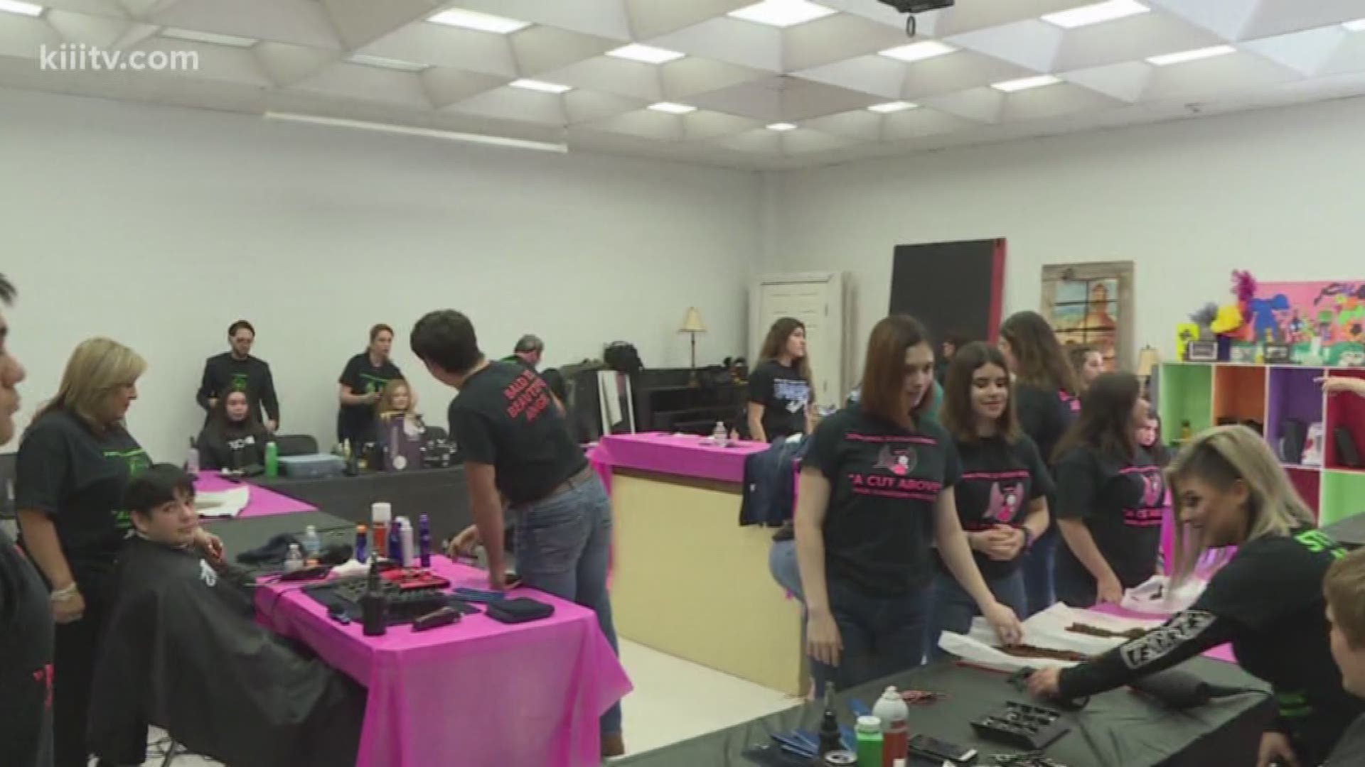 Students at Saint John Paul II High School donated their hair Tuesday for a good cause.