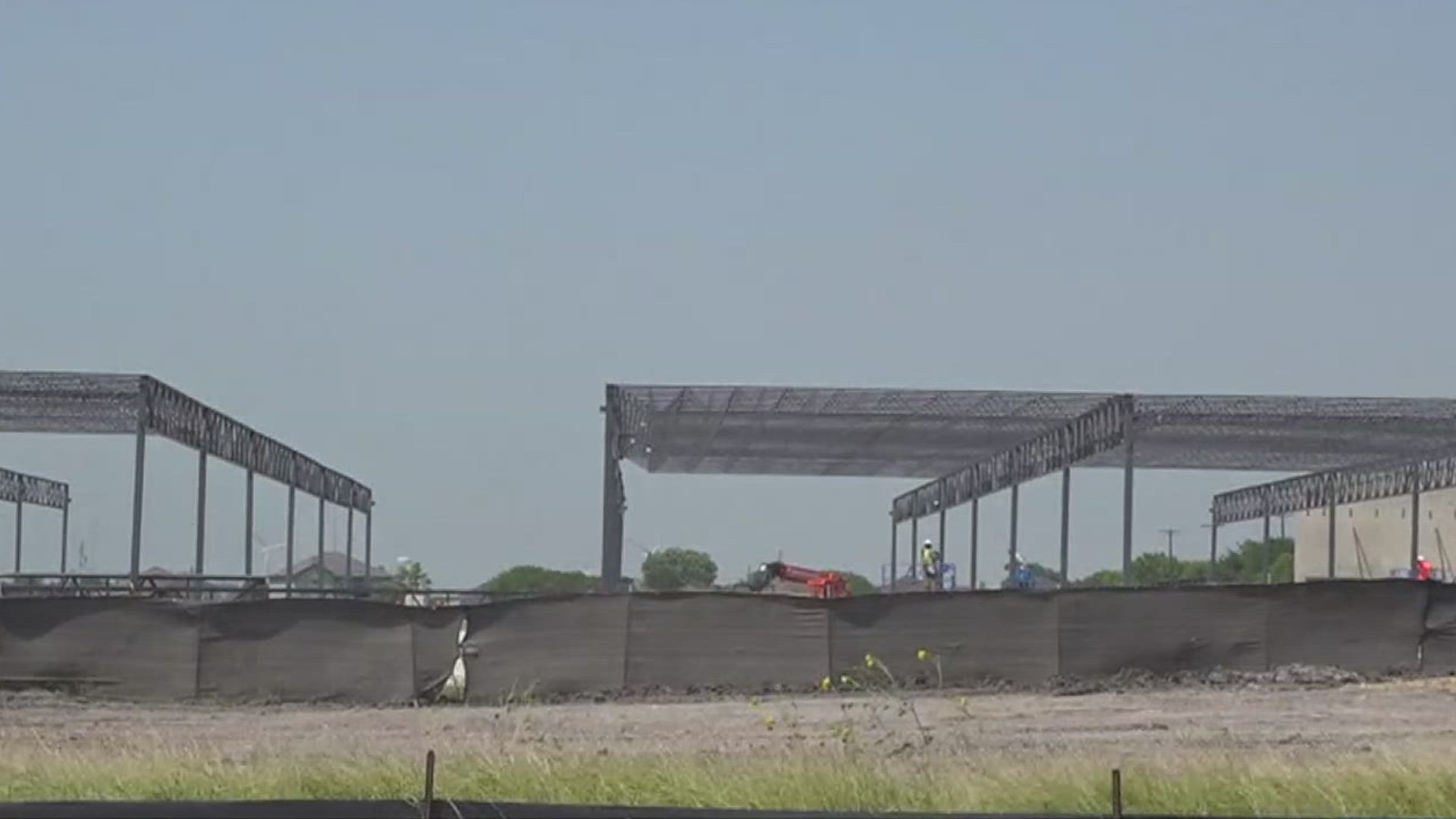 Walls are going up along Highway 181 and Broadway Blvd as the 45-acre Portland Town Center development site begins to take shape.