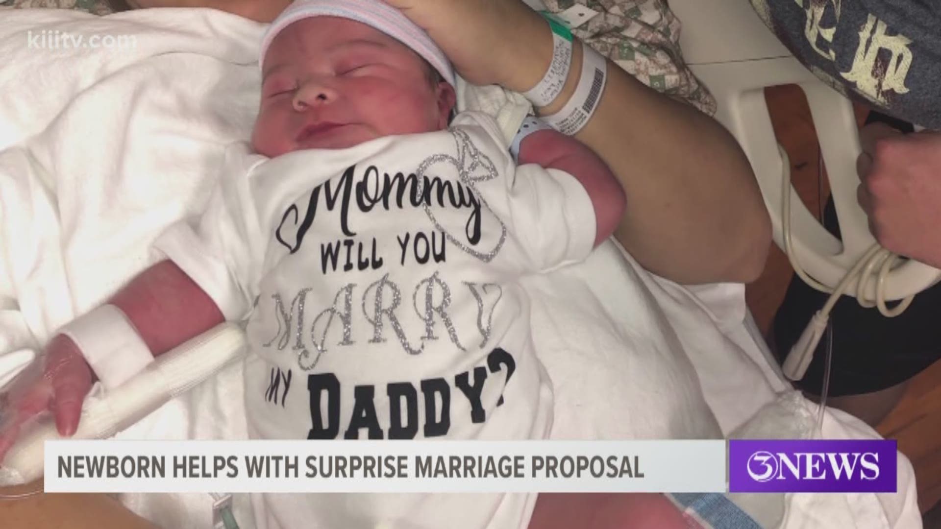 Lawrence Bergstrom pulled out a special onesie that read, "Mommy will you marry my Daddy?"