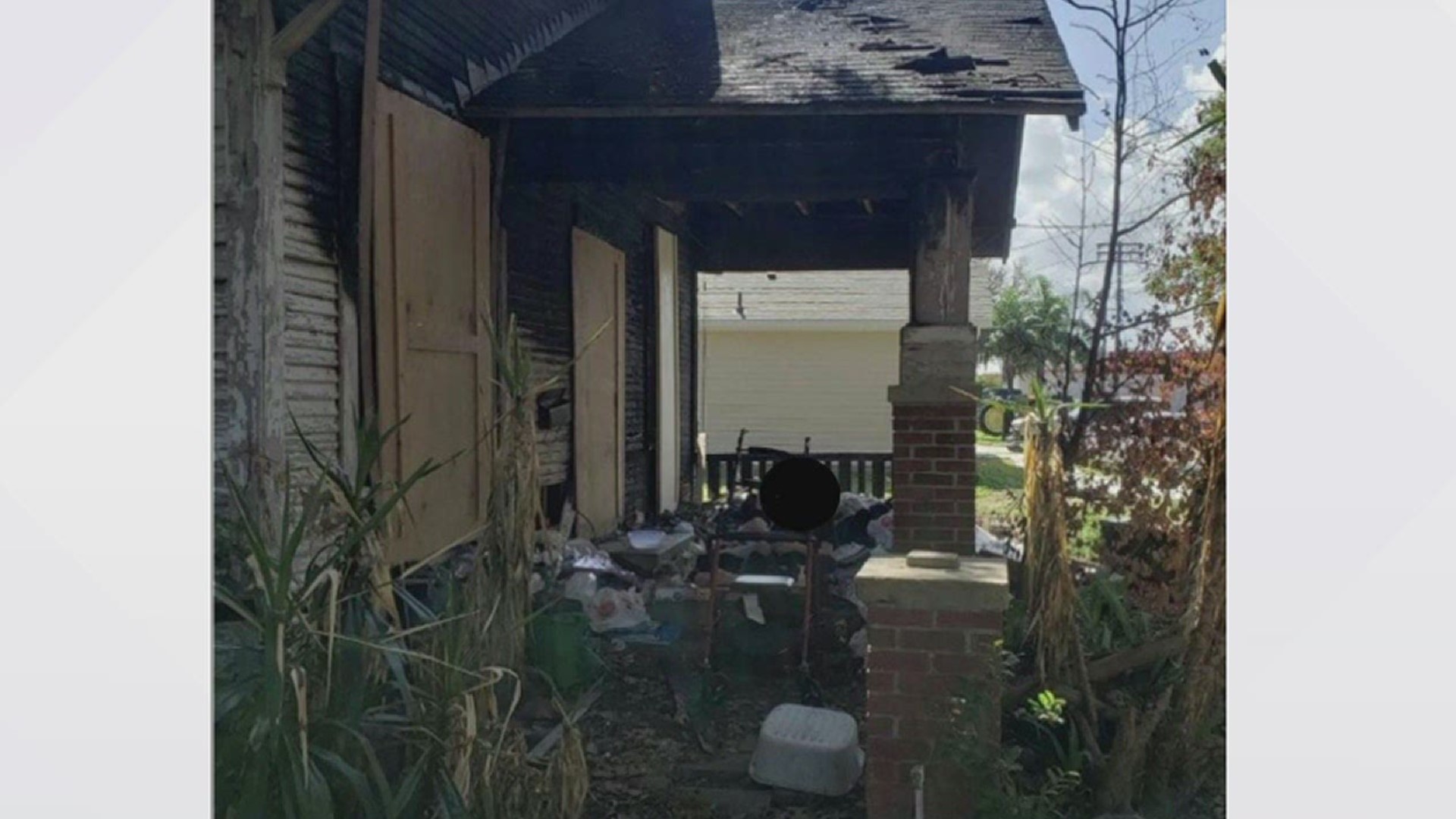 The 76-year-old woman was living in front of her home that was damaged after a fire.