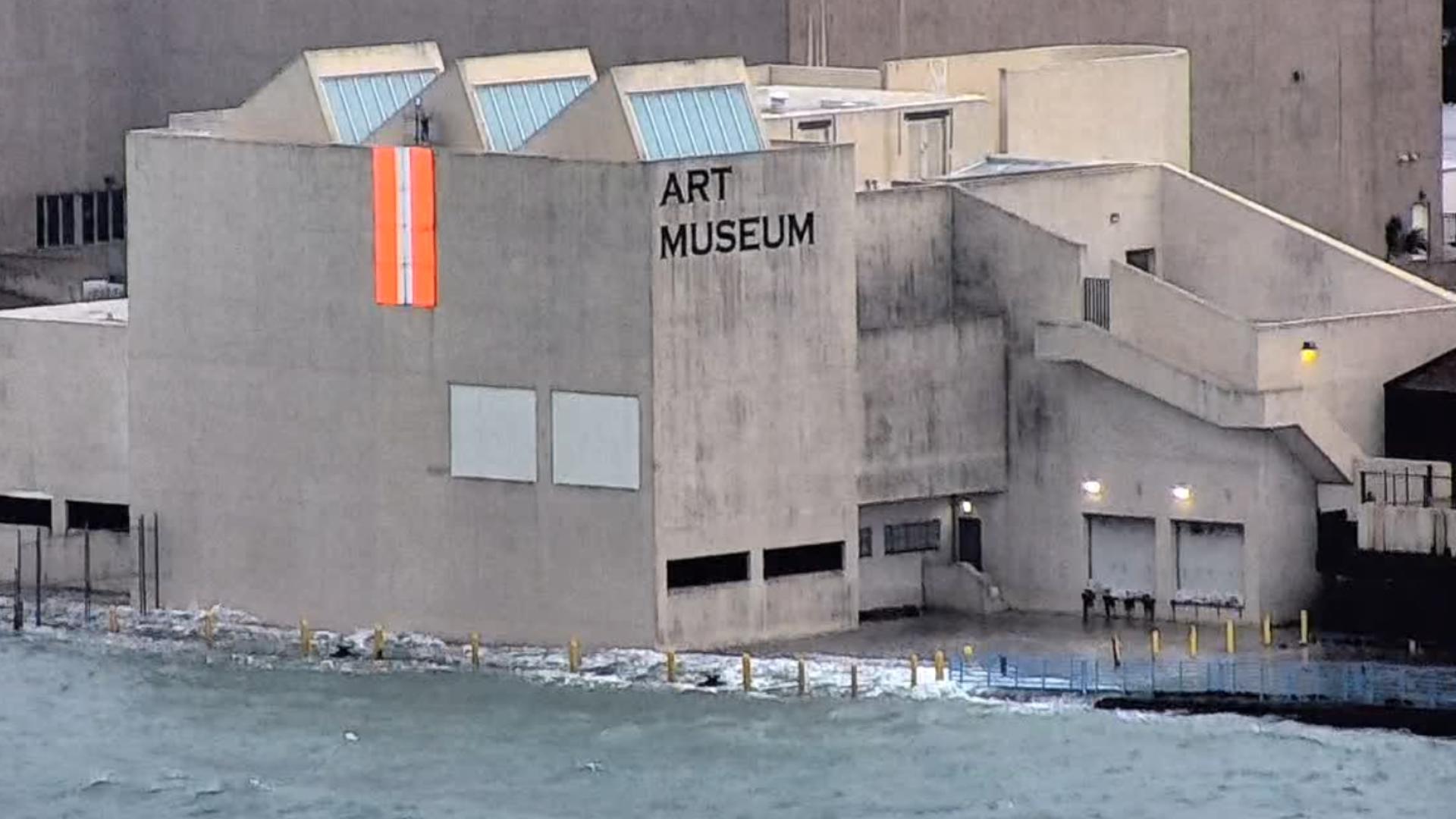 The water is crashing into the side of the building.