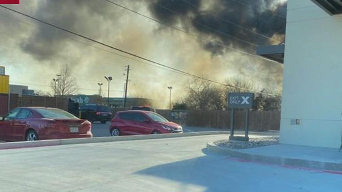 Firefighters work to contain fire at Sutherlands