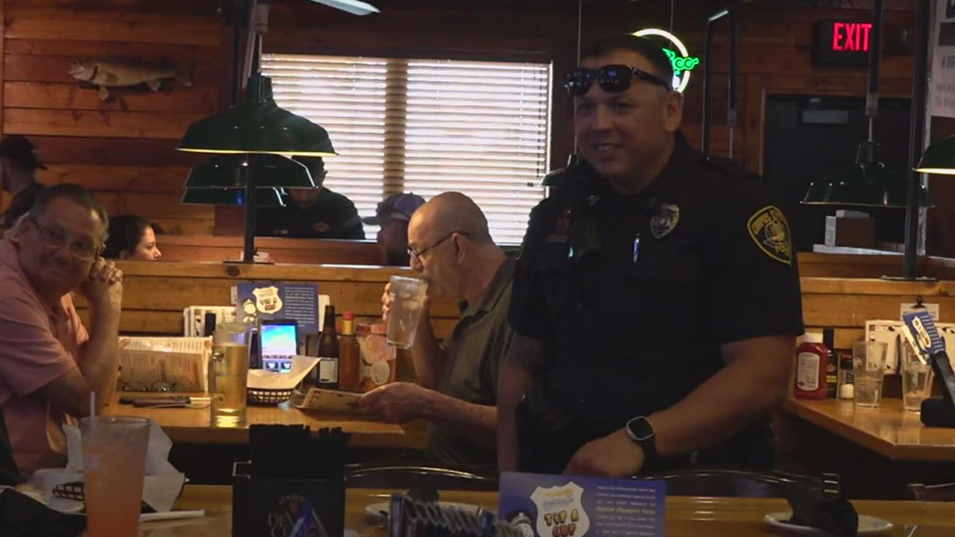 Officers traded in their badges for aprons as they transformed into waitstaff to take orders and collect donations for the nonprofit!