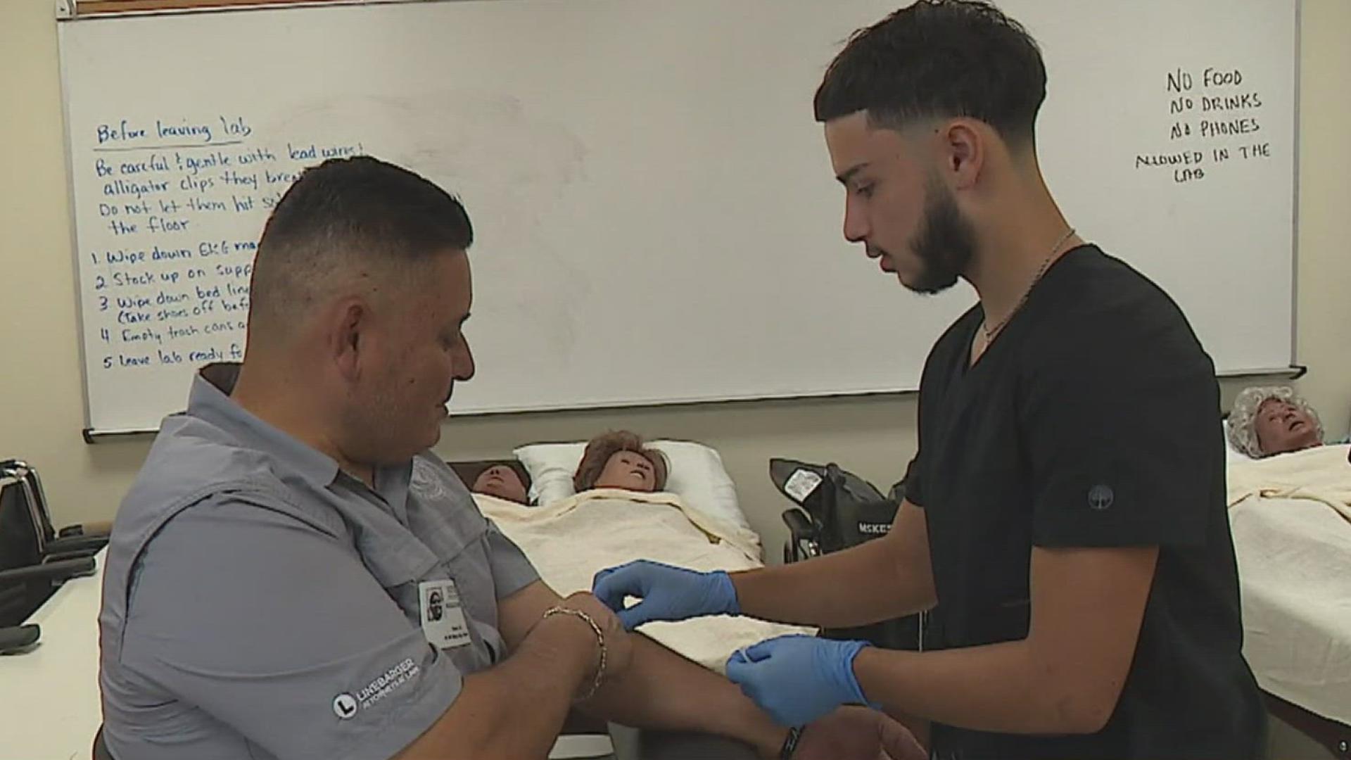 County Judge Rudy Madrid answered the call for volunteer patients and even allowed his own son Bryson Madrid to do the honors!