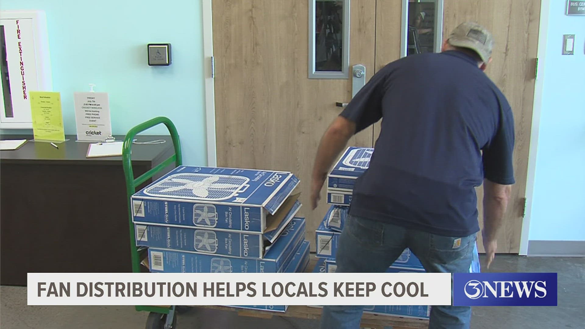 Fan distribution helps locals keep cool