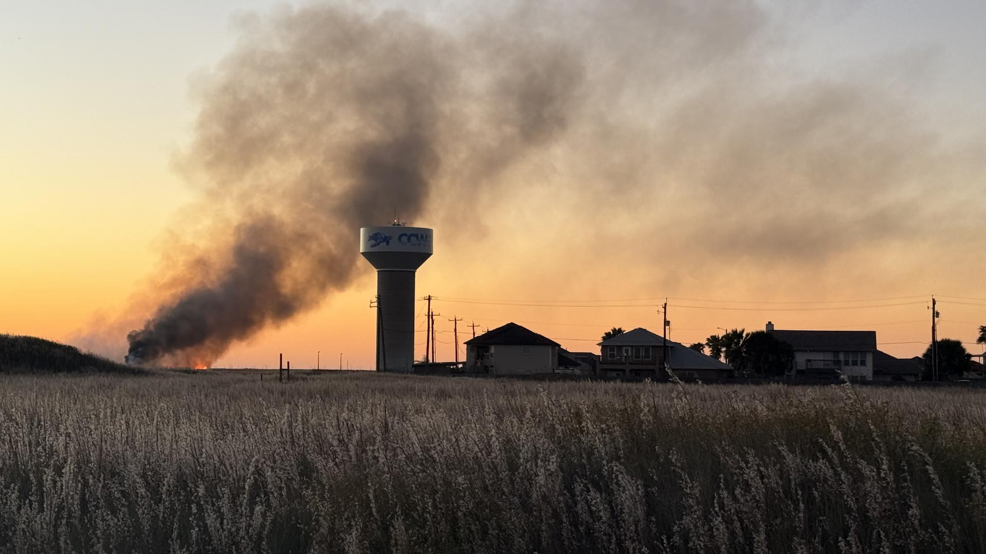 Nueces County ESD 2 crews are battling a grassfire just south of Sea Pines Drive, near the CCW water tower, according to Chief Wes Beseda.