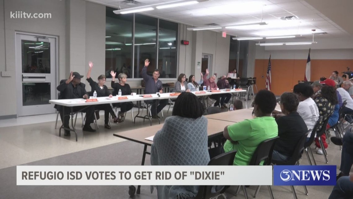 Many of the attendees at Tuesday's meeting are celebrating after the school board unanimously voted to get rid of the 'Dixie' school song.