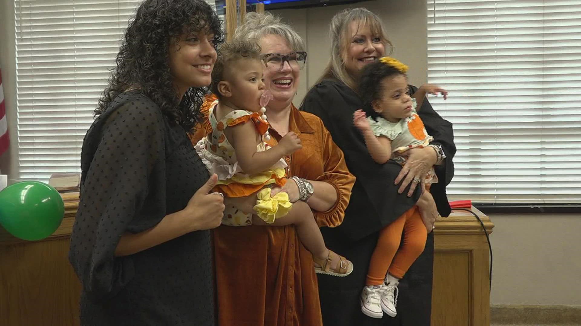 November is National Adoption Month. The courtroom of Judge Mandy Rodgers was packed with people waiting to complete their families.