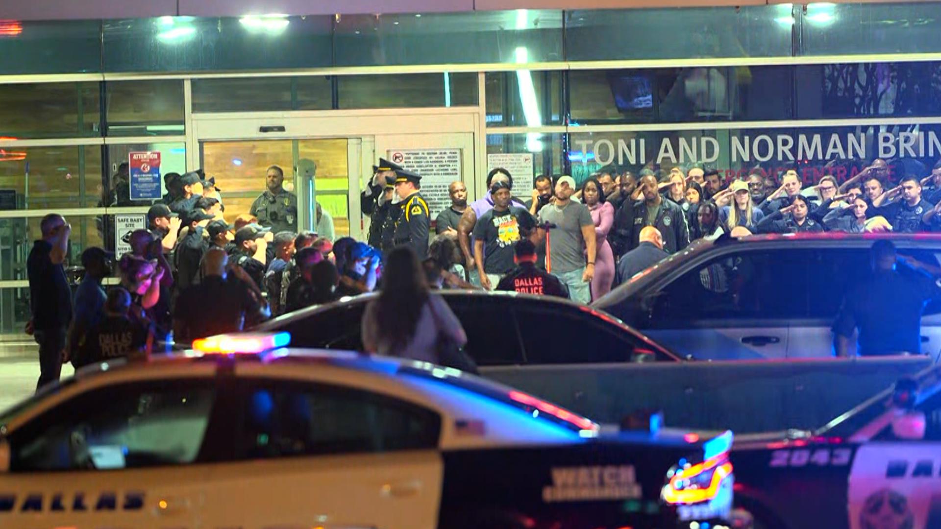 Dallas PD officers line up in front of Methodist Dallas Medical Center after multiple officers were shot.