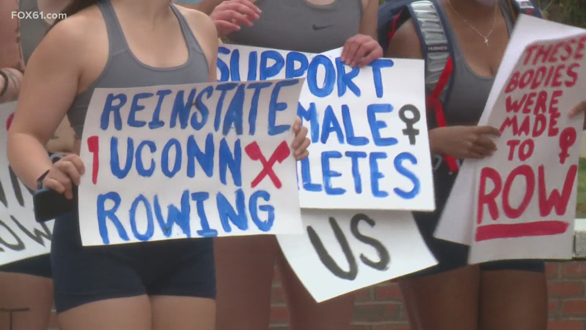 The UConn Women’s rowing team picked up their oars and marched across campus to call for the reinstatement of their sport Monday.